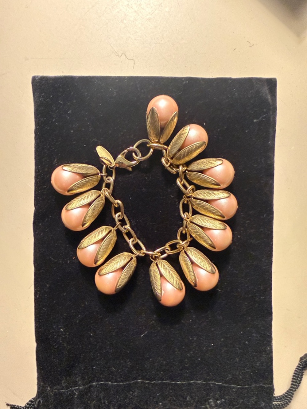 Lenora Dame blush pink pearl and gold leaf drop bracelet. Big hold and sturdy
